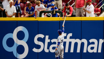 CINCINNATI, OHIO - SEPTEMBER 19: Mookie Betts #50 of the Los Angeles Dodgers gives the fan who caught the first major league hit and home run ball by TJ Friedl #29 of the Cincinnati Reds in exchange for the ball back during their game at Great American Ball Park on September 19, 2021 in Cincinnati, Ohio. (Photo by Emilee Chinn/Getty Images)