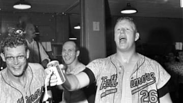 KANSAS CITY, MO - SEPTEMBER 22: (L to R) Gene Brabender #32; Brooks Robinson #5 and Boog Powell #26 of the Baltimore Orioles celebrate clinching the American League pennant in the clubhouse after a game on September 22, 1966 against the Kansas City A's at Municipal Stadium in Kansas City, Missouri. The Orioles beat the A's, 6-1. JV00116 (Photo by: John Vawter Collection/Diamond Images/Getty Images)