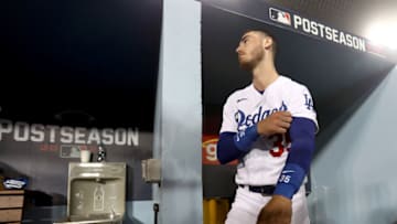 LOS ANGELES, CALIFORNIA - OCTOBER 11: Cody Bellinger #35 of the Los Angeles Dodgers stands in the dugout against the San Francisco Giants during the seventh inning in game 3 of the National League Division Series at Dodger Stadium on October 11, 2021 in Los Angeles, California. (Photo by Ronald Martinez/Getty Images)