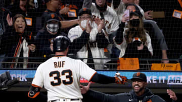 SAN FRANCISCO, CALIFORNIA - OCTOBER 14: Darin Ruf #33 and manager Gabe Kapler #19 of the San Francisco Giants celebrate Ruf's solo home run against the Los Angeles Dodgers during the sixth inning in game 5 of the National League Division Series at Oracle Park on October 14, 2021 in San Francisco, California. (Photo by Harry How/Getty Images)