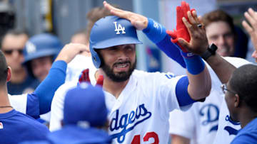 LOS ANGELES, CA - APRIL 20: Edwin Rios #43 of the Los Angeles Dodgers gets a pat on the helmet from Cody Bellinger as they celebrate the one run home run against starting pitcher Charlie Morton #50 of the Atlanta Braves during the fifth inning at Dodger Stadium on April 20, 2022 in Los Angeles, California. (Photo by Kevork Djansezian/Getty Images)
