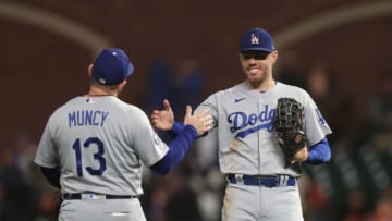 SAN FRANCISCO, CALIFORNIA - SEPTEMBER 17: Max Muncy #13 and Freddie Freeman #5 of the Los Angeles Dodgers celebrate after a win against the San Francisco Giants at Oracle Park on September 17, 2022 in San Francisco, California. (Photo by Lachlan Cunningham/Getty Images)