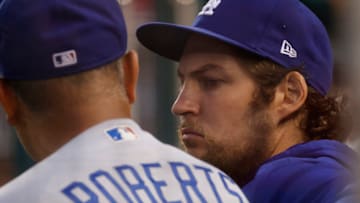 Jul 1, 2021; Washington, District of Columbia, USA; Los Angeles Dodgers starting pitcher Trevor Bauer (R) talks with Dodgers manager Dave Roberts (L) in the dugout against the Washington Nationals in the third inning at Nationals Park. Mandatory Credit: Geoff Burke-USA TODAY Sports