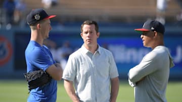 Jul 6, 2019; Los Angeles, CA, USA; Los Angeles Dodgers starting pitcher Walker Buehler (left) talks with assistant general manager Jeff Kingston (center) and manager Dave Roberts before the game against the San Diego Padres at Dodger Stadium. Mandatory Credit: Kirby Lee-USA TODAY Sports