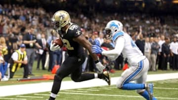 Dec 21, 2015; New Orleans, LA, USA; New Orleans Saints tight end Benjamin Watson (82) scores a touchdown on a one-yard catch while defended by Detroit Lions strong safety Isa Abdul-Quddus (42) in the fourth quarter of the game at the Mercedes-Benz Superdome. Mandatory Credit: Chuck Cook-USA TODAY Sports