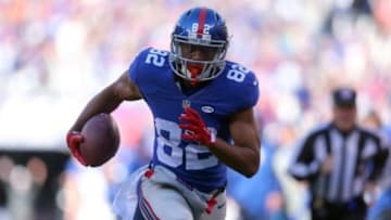 Dec 20, 2015; East Rutherford, NJ, USA; New York Giants wide receiver Rueben Randle (82) scores a touchdown against the Carolina Panthers during the first quarter at MetLife Stadium. Mandatory Credit: Brad Penner-USA TODAY Sports
