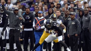 Dec 27, 2015; Baltimore, MD, USA; Baltimore Ravens cornerback Jimmy Smith (22) intercepts Pittsburgh Steelers quarterback Ben Roethlisberger (7) (not pictured) pass intended for wide receiver Antonio Brown (84) during the fourth quarter at M&T Bank Stadium. Baltimore Ravens defeated Pittsburgh Steelers 20-17. Mandatory Credit: Tommy Gilligan-USA TODAY Sports