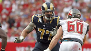 Sep 14, 2014; Tampa, FL, USA; St. Louis Rams tackle Jake Long (77) blocks against the Tampa Bay Buccaneers during the second half at Raymond James Stadium. St. Louis Rams defeated the Tampa Bay Buccaneers 19-17. Mandatory Credit: Kim Klement-USA TODAY Sports