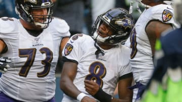 SEATTLE, WA - OCTOBER 20: Quarterback Lamar Jackson #8 of the Baltimore Ravens celebrates with Marshal Yanda #73 after scoring a touchdown in the third quarter against the Seattle Seahawks at CenturyLink Field on October 20, 2019 in Seattle, Washington. (Photo by Otto Greule Jr/Getty Images)