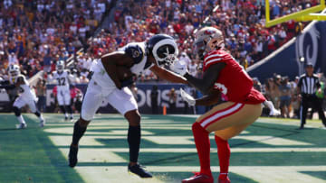 LOS ANGELES, CALIFORNIA - OCTOBER 13: Deebo Samuel #19 of the San Francisco 49ers pulls down Marcus Peters #22 of the Los Angeles Rams by the facemask resulting in a penalty on the San Francisco 49ers at Los Angeles Memorial Coliseum on October 13, 2019 in Los Angeles, California. (Photo by Joe Scarnici/Getty Images)