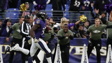 BALTIMORE, MARYLAND - NOVEMBER 17: Running Back Gus Edwards #35 of the Baltimore Ravens runs for a touchdown during the second half against the Houston Texans at M&T Bank Stadium on November 17, 2019 in Baltimore, Maryland. (Photo by Todd Olszewski/Getty Images)