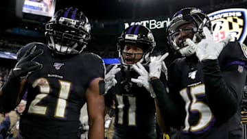 BALTIMORE, MARYLAND - DECEMBER 12: Wide receiver Seth Roberts #11 of the Baltimore Ravens and teammates running back Mark Ingram #21 and wide receiver Marquise Brown #15 celebrate Roberts' touchdown in the third quarter of the game against the New York Jets at M&T Bank Stadium on December 12, 2019 in Baltimore, Maryland. (Photo by Patrick Smith/Getty Images)