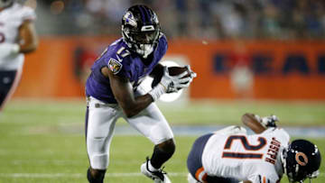 CANTON, OH - AUGUST 02: Jordan Lasley #17 of the Baltimore Ravens breaks a tackle after a reception against Michael Joseph #21 of the Chicago Bears in the third quarter of the Hall of Fame Game at Tom Benson Hall of Fame Stadium on August 2, 2018 in Canton, Ohio. (Photo by Joe Robbins/Getty Images)