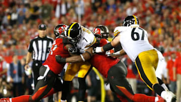 TAMPA, FL - SEPTEMBER 24: Quarterback Ben Roethlisberger #7 of the Pittsburgh Steelers is sacked by defensive end Vinny Curry #97 of the Tampa Bay Buccaneers and defensive tackle Gerald McCoy #93 during the second quarter of a game on September 24, 2018 at Raymond James Stadium in Tampa, Florida. (Photo by Brian Blanco/Getty Images)