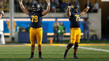 BERKELEY, CA - OCTOBER 27: Patrick Mekari #79 and Will Craig #75 of the California Golden Bears celebrate after defeating Washington Huskies at California Memorial Stadium on October 27, 2018 in Berkeley, California. (Photo by Lachlan Cunningham/Getty Images)