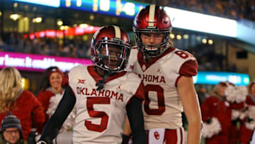 MORGANTOWN, WV - NOVEMBER 23: Marquise Brown #5 of the Oklahoma Sooners celebrates after catching a 45 yard touchdown pass against the West Virginia Mountaineers on November 23, 2018 at Mountaineer Field in Morgantown, West Virginia. (Photo by Justin K. Aller/Getty Images)