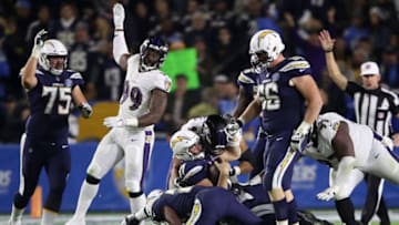 CARSON, CA - DECEMBER 22: Chris Wormley #93 of the Baltimore Ravens sacks Philip Rivers #17 as Dan Feeney #66 and Michael Schofield #75 of the Los Angeles Chargers look on during the second half of a game at StubHub Center on December 22, 2018 in Carson, California. (Photo by Sean M. Haffey/Getty Images)