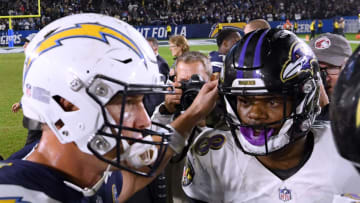 CARSON, CALIFORNIA - DECEMBER 22: Lamar Jackson #8 of the Baltimore Ravens and Philip Rivers #17 of the Los Angeles Chargers meet on the field after a 22-10 Ravens win at StubHub Center on December 22, 2018 in Carson, California. (Photo by Harry How/Getty Images)
