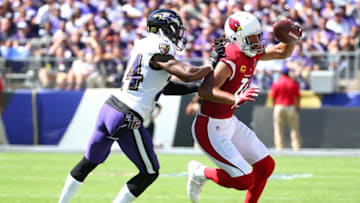 BALTIMORE, MD - SEPTEMBER 15: Larry Fitzgerald #11 of the Arizona Cardinals makes a catch and is pushed out of bounds by Brandon Carr #24 of the Baltimore Ravens during the first half at M&T Bank Stadium on September 15, 2019 in Baltimore, Maryland. (Photo by Dan Kubus/Getty Images)