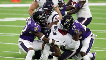 HOUSTON, TEXAS - SEPTEMBER 20: Deshaun Watson #4 of the Houston Texans is sacked by DeShon Elliott #32 and Patrick Queen #48 of the Baltimore Ravens during the first half at NRG Stadium on September 20, 2020 in Houston, Texas. (Photo by Bob Levey/Getty Images)