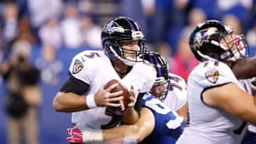 INDIANAPOLIS, IN - OCTOBER 5: Joe Flacco #5 of the Baltimore Ravens gets sacked by Bjoern Werner #92 of the Indianapolis Colts in the fourth quarter of the game at Lucas Oil Stadium on October 5, 2014 in Indianapolis, Indiana. The Colts defeated the Ravens 20-13. (Photo by Joe Robbins/Getty Images)