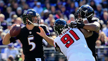 BALTIMORE, MD - OCTOBER 19: Quarterback Joe Flacco #5 of the Baltimore Ravens drops back to pass against the Atlanta Falcons at M&T Bank Stadium on October 19, 2014 in Baltimore, Maryland. (Photo by Rob Carr/Getty Images)