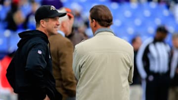 BALTIMORE, MD - DECEMBER 28: Head coach John Harbaugh of the Baltimore Ravens (Left) speaks with Baltimore Ravens owner Steve Bisciotti (Right) before a game against the Cleveland Browns at M&T Bank Stadium on December 28, 2014 in Baltimore, Maryland. (Photo by Rob Carr/Getty Images)