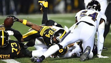 PITTSBURGH, PA - DECEMBER 25: Antonio Brown #84 of the Pittsburgh Steelers reaches for the end zone to score a 4 yard touchdown in the fourth quarter during the game against the Baltimore Ravens at Heinz Field on December 25, 2016 in Pittsburgh, Pennsylvania. (Photo by Joe Sargent/Getty Images)