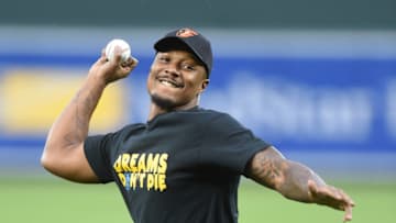 BALTIMORE, MD - MAY 06: Baltimore Ravens football player Tony Jefferson throws out the first pitch during a baseball game Baltimore Orioles and the Chicago White Sox at Oriole Park at Camden Yards on May 6, 2017 in Baltimore, Maryland. (Photo by Mitchell Layton/Getty Images)