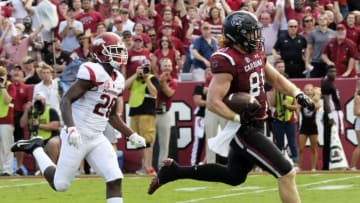 COLUMBIA, SC - OCTOBER 7: Tight end Hayden Hurst #81 of the South Carolina Gamecocks runs for a touchdown as he's chased by defensive back De'Andre Coley #20 of the Arkansas Razorbacks at Williams-Brice Stadium on October 7, 2017 in Columbia, South Carolina. (Photo by Todd Bennett/GettyImages)