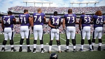 BALTIMORE, MD - SEPTEMBER 27: Running back Lorenzo Taliaferro #34 of the Baltimore Ravens and teammates look on during the national anthem before playing against the Cincinnati Bengals at M&T Bank Stadium on September 27, 2015 in Baltimore, Maryland. (Photo by Patrick Smith/Getty Images)