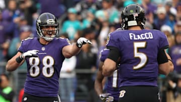 BALTIMORE, MD - DECEMBER 4: Tight end Dennis Pitta #88 of the Baltimore Ravens celebrates with teammate quarterback Joe Flacco #5 after scoring a second quarter touchdown against the Miami Dolphins at M&T Bank Stadium on December 4, 2016 in Baltimore, Maryland. (Photo by Patrick Smith/Getty Images)