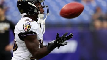 BALTIMORE, MD - AUGUST 10: Running back Taquan Mizzell #33 of the Baltimore Ravens warms up before the start of a preseason game against the Washington Redskins at M&T Bank Stadium on August 10, 2017 in Baltimore, Maryland. (Photo by Rob Carr/Getty Images)
