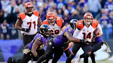BALTIMORE, MD - NOVEMBER 10: Quarterback Andy Dalton #14 of the Cincinnati Bengals is tackled by outside linebacker Terrell Suggs #55 of the Baltimore Ravens during the fourth quarter of the Ravens 20-17 overtime win at M&T Bank Stadium on November 10, 2013 in Baltimore, Maryland. (Photo by Rob Carr/Getty Images)