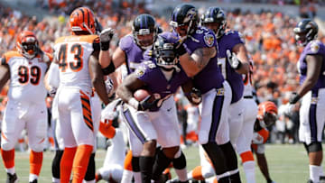 CINCINNATI, OH - SEPTEMBER 10: Terrance West #28 of the Baltimore Ravens is congratulated by his teammates after scoring a touchdown during the second quarter of the game against the Cincinnati Bengals at Paul Brown Stadium on September 10, 2017 in Cincinnati, Ohio. (Photo by Michael Reaves/Getty Images)
