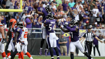 BALTIMORE, MD - SEPTEMBER 17: Cornerback Brandon Carr #24 of the Baltimore Ravens celebrates with Tyus Bowser #54 and C.J. Mosley #57 after intercepting a Cleveland Browns pass late in the fourth quarter at M&T Bank Stadium on September 17, 2017 in Baltimore, Maryland. (Photo by Rob Carr/Getty Images)
