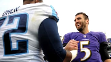 BALTIMORE, MD - NOVEMBER 09: Quarterback Joe Flacco #5 of the Baltimore Ravens talks to tackle Michael Oher #72 of the Tennessee Titans after an NFL game at M&T Bank Stadium on November 9, 2014 in Baltimore, Maryland. (Photo by Patrick Smith/Getty Images)