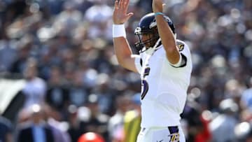 OAKLAND, CA - OCTOBER 08: Joe Flacco #5 of the Baltimore Ravens celebrates after a touchdown by Javorius Allen #37 during their NFL game against the Oakland Raiders at Oakland-Alameda County Coliseum on October 8, 2017 in Oakland, California. (Photo by Ezra Shaw/Getty Images)
