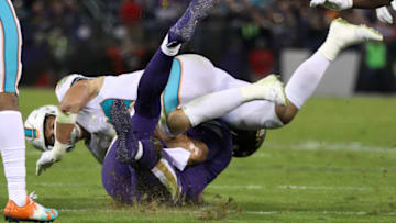BALTIMORE, MD - OCTOBER 26: Quarterback Joe Flacco #5 of the Baltimore Ravens is hit by middle linebacker Kiko Alonso #47 of the Miami Dolphins as he slides in the second quarter against the Miami Dolphins at M&T Bank Stadium on October 26, 2017 in Baltimore, Maryland. (Photo by Patrick Smith/Getty Images)