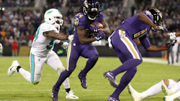 BALTIMORE, MD - OCTOBER 26: Running Back Alex Collins #34 of the Baltimore Ravens carries the ball in the second quarter against the Miami Dolphins at M&T Bank Stadium on October 26, 2017 in Baltimore, Maryland. (Photo by Rob Carr/Getty Images)