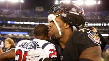 BALTIMORE, MD - NOVEMBER 27: Outside Linebacker Terrell Suggs #55 of the Baltimore Ravens hugs cornerback Kareem Jackson #25 of the Houston Texans after the Ravens win 23-16 at M&T Bank Stadium on November 27, 2017 in Baltimore, Maryland. (Photo by Scott Taetsch/Getty Images)