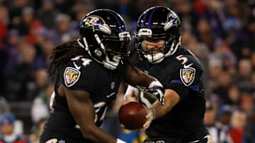 BALTIMORE, MD - NOVEMBER 27: Quarterback Joe Flacco #5 hands the ball off to running back Alex Collins #34 of the Baltimore Ravens in the second quarter against the Houston Texans at M&T Bank Stadium on November 27, 2017 in Baltimore, Maryland. (Photo by Scott Taetsch/Getty Images)