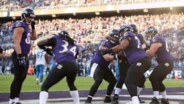 BALTIMORE, MD - DECEMBER 3: Running Back Alex Collins #34 of the Baltimore Ravens celebrates with teammates after a touchdown in the fourth quarter against the Detroit Lions at M&T Bank Stadium on December 3, 2017 in Baltimore, Maryland. (Photo by Patrick Smith/Getty Images)