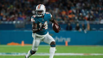 MIAMI GARDENS, FL - DECEMBER 11: Jarvis Landry #14 of the Miami Dolphins carries the ball in the first quarter against the New England Patriots at Hard Rock Stadium on December 11, 2017 in Miami Gardens, Florida. (Photo by Mike Ehrmann/Getty Images)