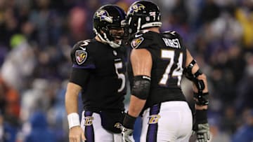 BALTIMORE, MD - DECEMBER 23: Quarterback Joe Flacco #5 and offensive guard James Hurst #74 of the Baltimore Ravens celebrate after a touchdown in the fourth quarter against the Indianapolis Colts at M&T Bank Stadium on December 23, 2017 in Baltimore, Maryland. (Photo by Patrick Smith/Getty Images)