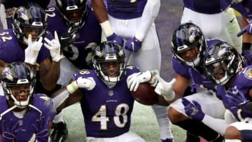 BALTIMORE, MARYLAND - OCTOBER 11: Inside linebacker Patrick Queen #48 of the Baltimore Ravens celebrates after returning a fumble for a fourth quarter touchdown against the Cincinnati Bengals at M&T Bank Stadium on October 11, 2020 in Baltimore, Maryland. (Photo by Rob Carr/Getty Images)