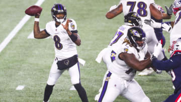 FOXBOROUGH, MASSACHUSETTS - NOVEMBER 15: Lamar Jackson #8 of the Baltimore Ravens throws the ball during a game against the New England Patriots at Gillette Stadium on November 15, 2020 in Foxborough, Massachusetts. (Photo by Adam Glanzman/Getty Images)