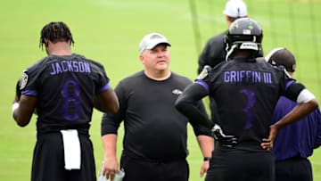 Jun 13, 2019; Baltimore, MD, USA; Baltimore Ravens offensive coordinator Greg Roman (center) talks to quarterbacks Lamar Jackson (8) and Robert Griffin III (3) during minicamp at Under Armour Performance Center. Mandatory Credit: Evan Habeeb-USA TODAY Sports