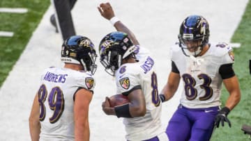 Nov 8, 2020; Indianapolis, Indiana, USA; Baltimore Ravens quarterback Lamar Jackson (8) celebrates with teammates after scoring a touchdown against the Indianapolis Colts in the second half at Lucas Oil Stadium. Mandatory Credit: Trevor Ruszkowski-USA TODAY Sports