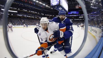 Apr 27, 2016; Tampa, FL, USA; New York Islanders defenseman Travis Hamonic (3) and Tampa Bay Lightning center Alex Killorn (17) fight to control the puck on the boards during the first period in game one of the second round of the 2016 Stanley Cup Playoffs at Amalie Arena. Mandatory Credit: Kim Klement-USA TODAY Sports